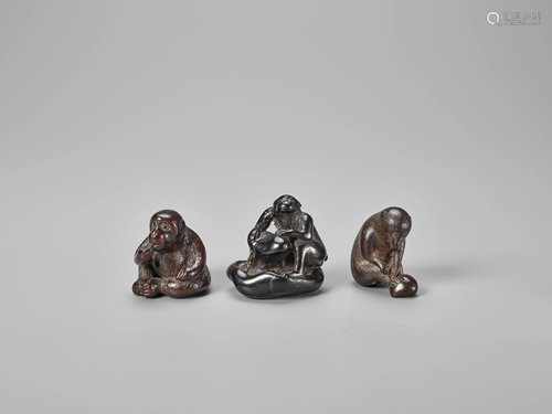 A GROUP OF THREE WOOD NETSUKE OF MONKEYS