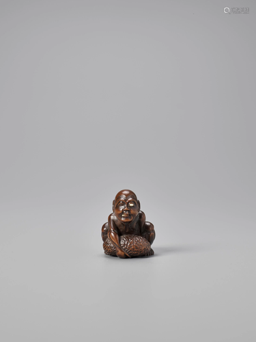 GYOKKEI: AN INLAID WOOD NETSUKE OF A STON…