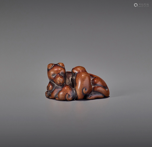 TOMONOBU: A WOOD NETSUKE OF A BITCH AND T…