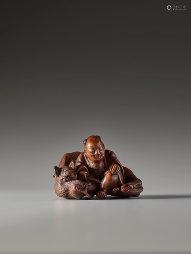 MASASHIGE: A WOOD NETSUKE OF AN OX HERDER