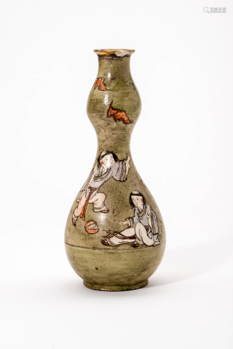 A CERAMIC VASE WITH PLAYING BOYS AND BATS