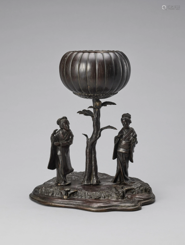 A BRONZE FIGURAL GROUP