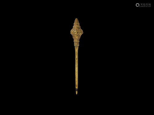 A CHAM GILT HAIRPIN WITH A FINIAL