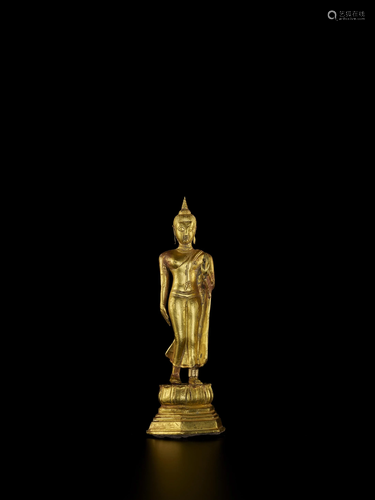 A THAI REPOUSSE GOLD BUDDHA FIGURE