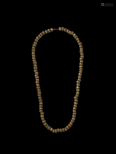 A LONG CHAM GOLD NECKLACE WITH GOLD BEADS