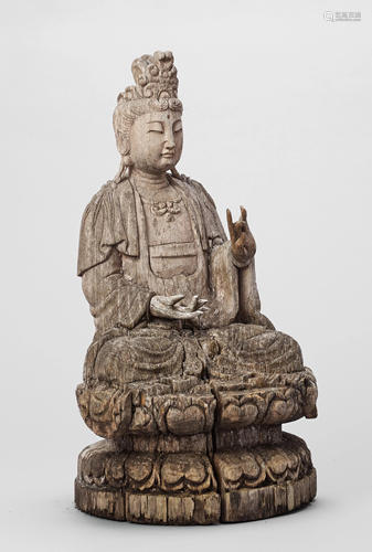 A LARGE CARVED WOOD FIGURE OF GUANYIN…