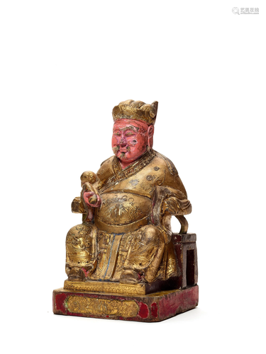 A LACQUERED AND GILT WOOD FIGURE GUANDI…