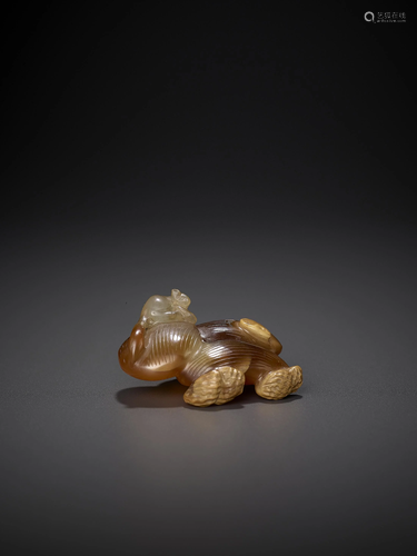 A CHALCEDONY PEANUTS AND JUJUBE CARVI…