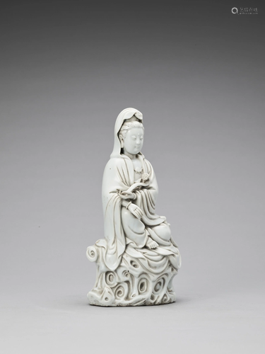 A GLAZED DEHUA PORCELAIN FIGURE OF GUA…