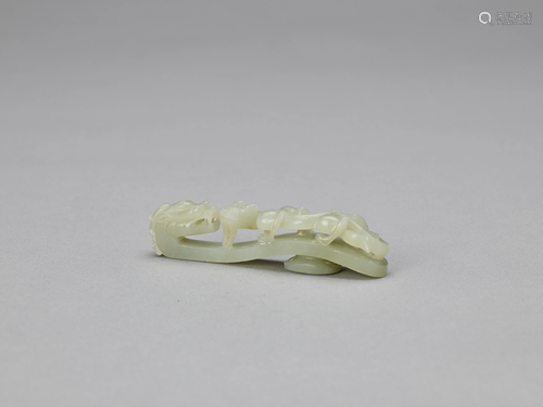 A CELADON JADE 'DRAGON' BELT HOOK, QING