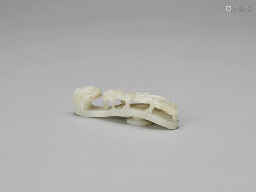 A PALE CELADON JADE 'DRAGON' BELT HOOK, QING