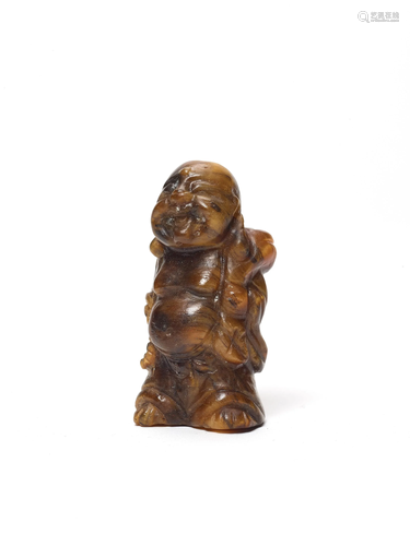 A TIGER'S EYE MINIATURE CARVING OF BUDAI