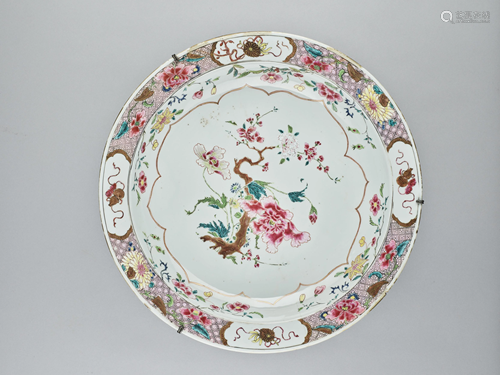 A GILT AND FAMILLE ROSE ENAMELED CHARGER, …