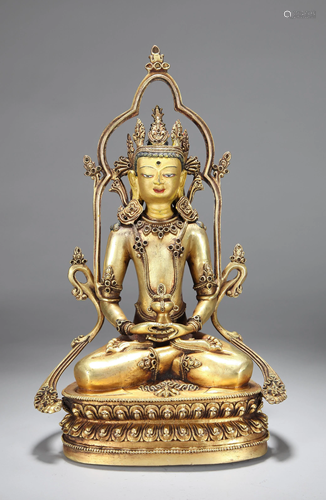 A CHINESE GILT BRONZE FIGURE OF BUDDHA…