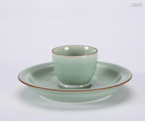 A CHINESE CELADON CUP AND HOLDER, JING WEI…