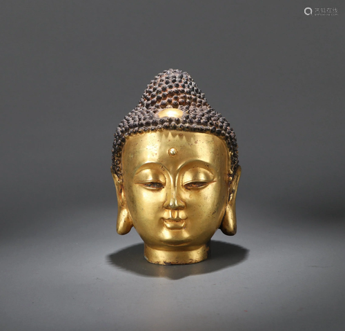 A CHINESE GILT BRONZE FIGURE OF BUDDHA…