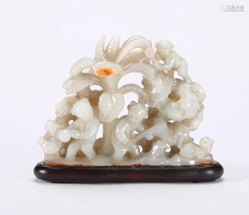 A CHINESE CARVED WHITE JADE BOULDER, QING…