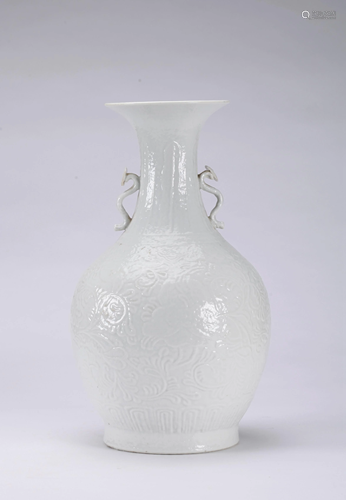 A CHINESE MOULDED WHITE GLAZED VASE, QING …