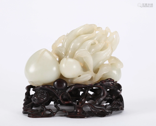 A CHINESE CARVED WHITE JADE BOULDER, QING…