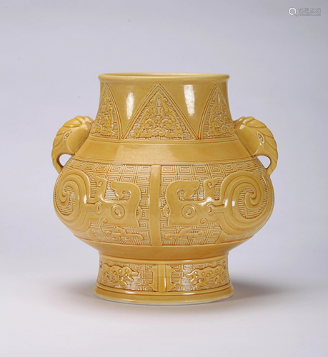 A CHINESE MOULDED YELLOW GLAZED ZUN VASE, …