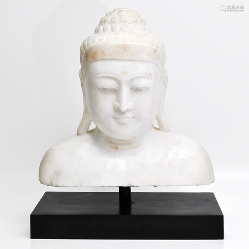 A Carved Marble Buddha Bust