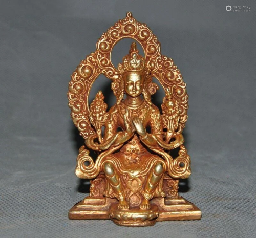 A BRONZE GILT 24KT/GOLD GUANYIN BUDD…