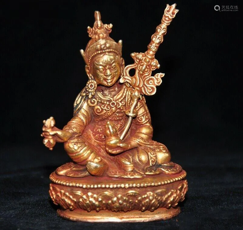 A BRONZE GILT 24KT/GOLD RINPOCHE BUD…