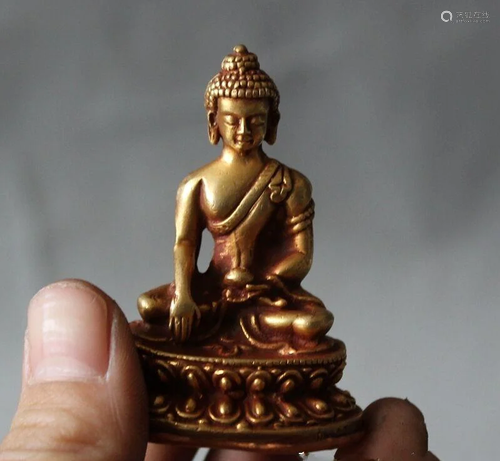 A BRONZE GILT 24KT/GOLD SHAKYAMUNI BU…