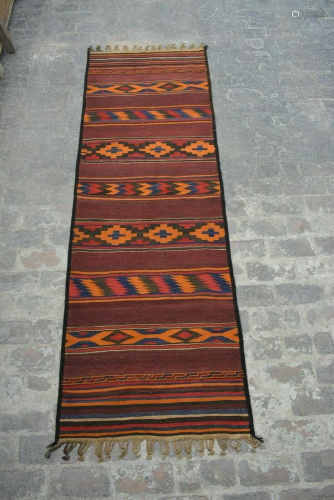 A VINTAGE AFGHANI WOVEN KILIM RUNNER.