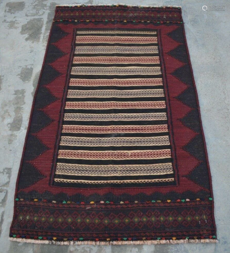 A VINTAGE AFGHANI WOVEN TURKISH KILIM.