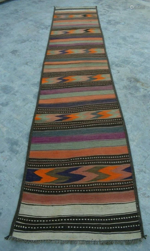 A VINTAGE AFGHANI WOVEN HALLWAY KILIM RUN…