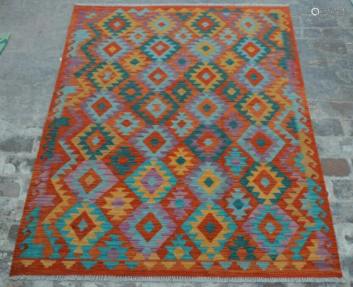 A VINTAGE AFGHANI WOVEN TURKISH RUG.