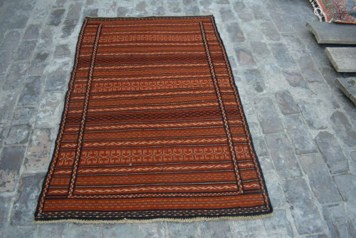 A VINTAGE AFGHANI WOVEN KALATI KILIM.