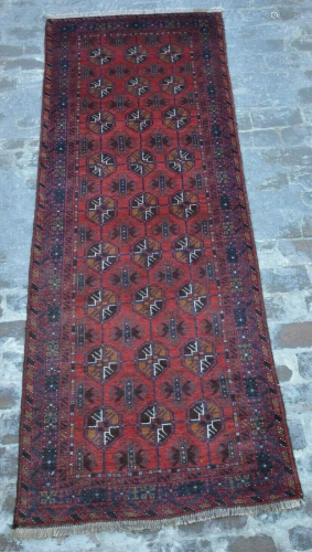 A VINTAGE AFGHANI WOOL TURKOMAN RUG RUN…