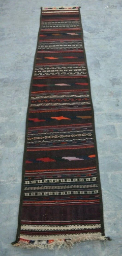 A VINTAGE AFGHANI WOVEN HALLWAY KILIM RUN…