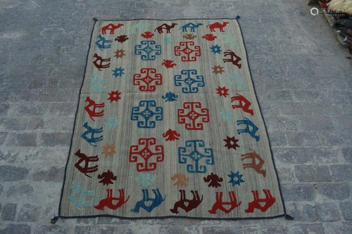 A VINTAGE AFGHANI WOVEN UZBEK KILIM.