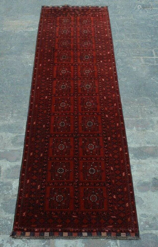 A VINTAGE AFGHANI WOOL TURKOMAN RUG RUN…