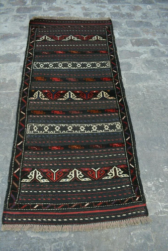 A VINTAGE AFGHANI WOVEN ADRASKAN KILIM.