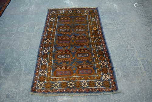 A VINTAGE AFGHANI WOOL TANG RUG.