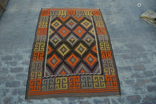 A VINTAGE AFGHANI WOVEN KILIM.