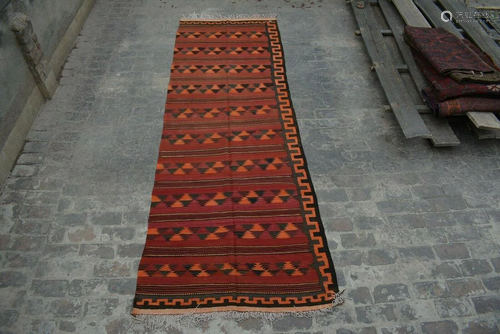 A VINTAGE AFGHANI WOVEN KILIM RUNNER.