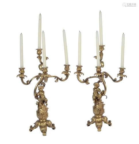 A pair of French gilt bronze four light candelabra in Louis XVI style