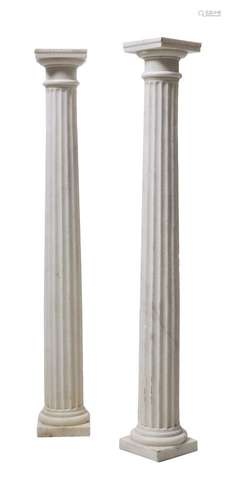 A pair of white marble columnar plinths