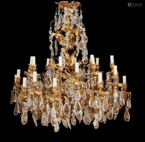 A fine French gilt bronze and cut glass hung twenty four light chandelier in Louis XV style