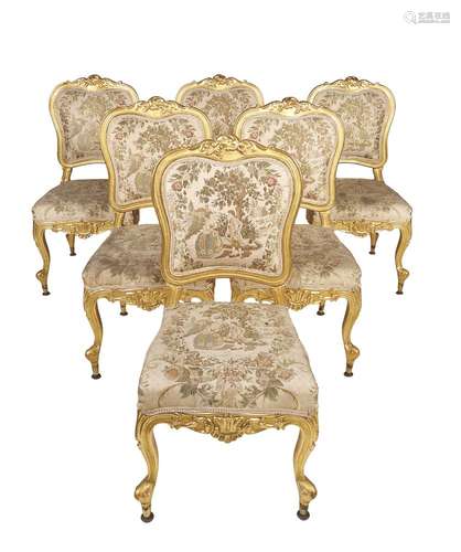 A set of twelve giltwood side chairs in Louis XVI style