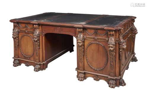 A carved mahogany twin pedestal partner's desk in George III style