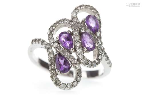 A PURPLE GEM SET AND DIAMOND RING