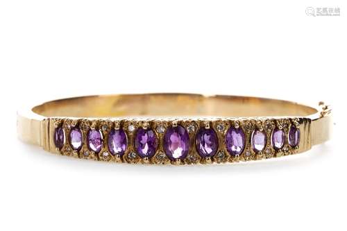 A PURPLE GEM AND DIAMOND BANGLE