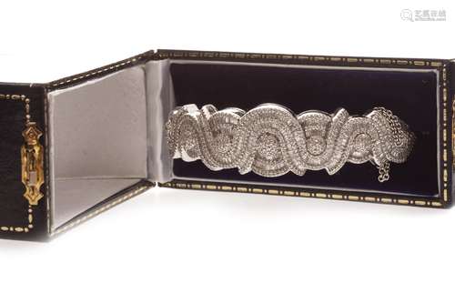 AN IMPRESSIVE DIAMOND SET BANGLE