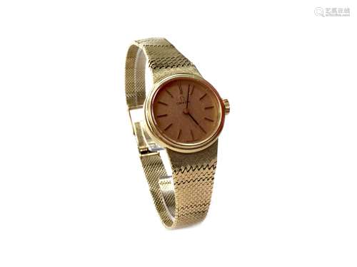 A LADY'S OMEGA GOLD WATCH